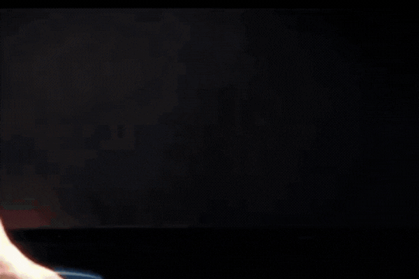 A close-up GIF of water beading and sliding off a glossy black car surface, visually demonstrating what is ceramic coating and its hydrophobic effect that protects the paint from contaminants.